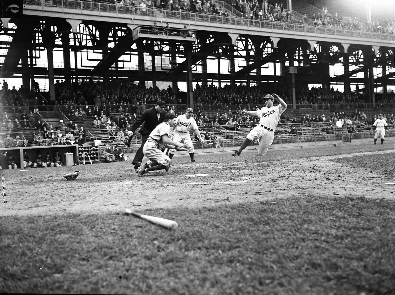 Brooklyn Dodgers Player Jumping Towards Home Plate At Ebbets Field, Brooklyn, 1940S