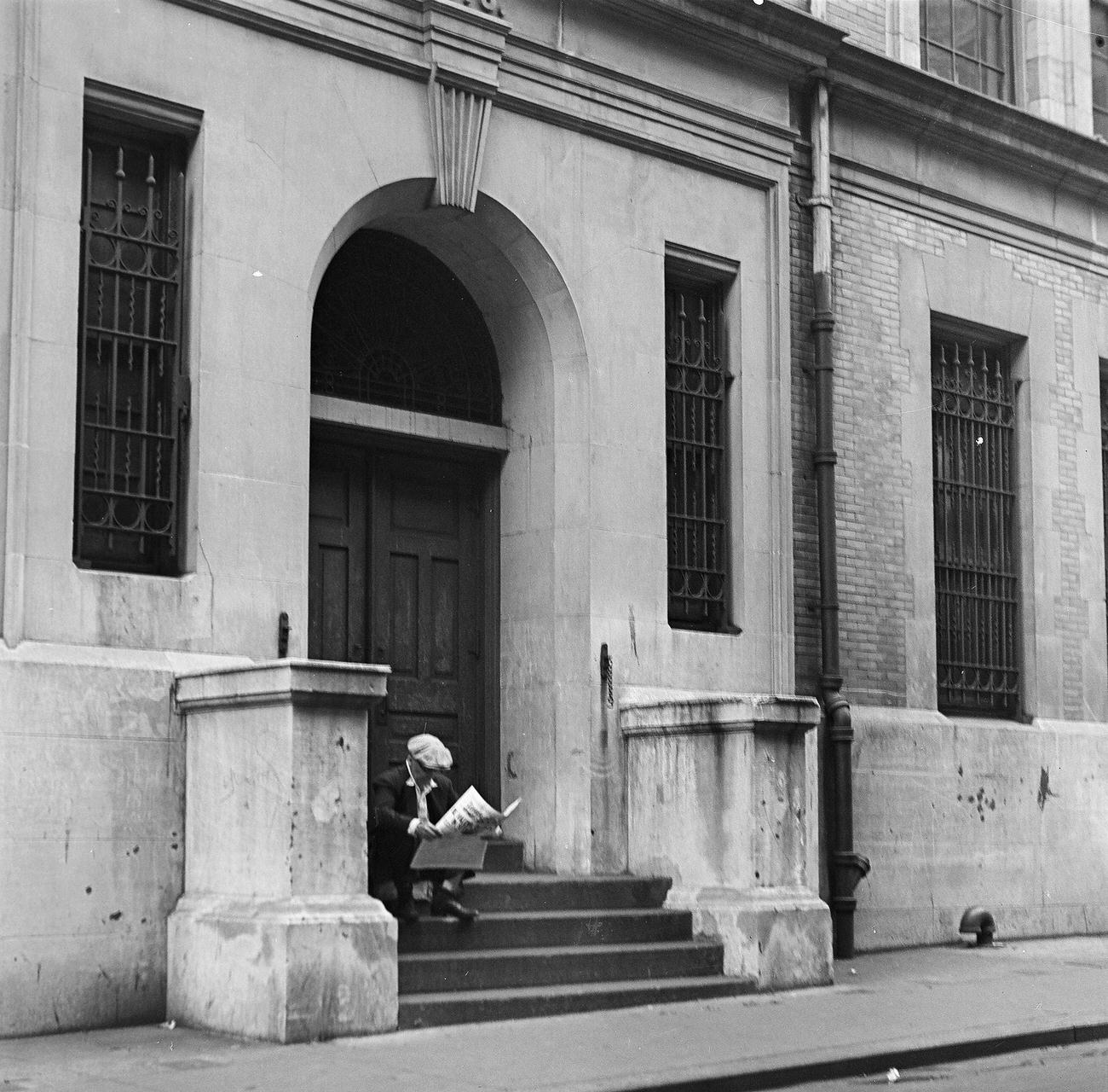 Man Reading Newspaper On Building Steps, Brooklyn, 1945