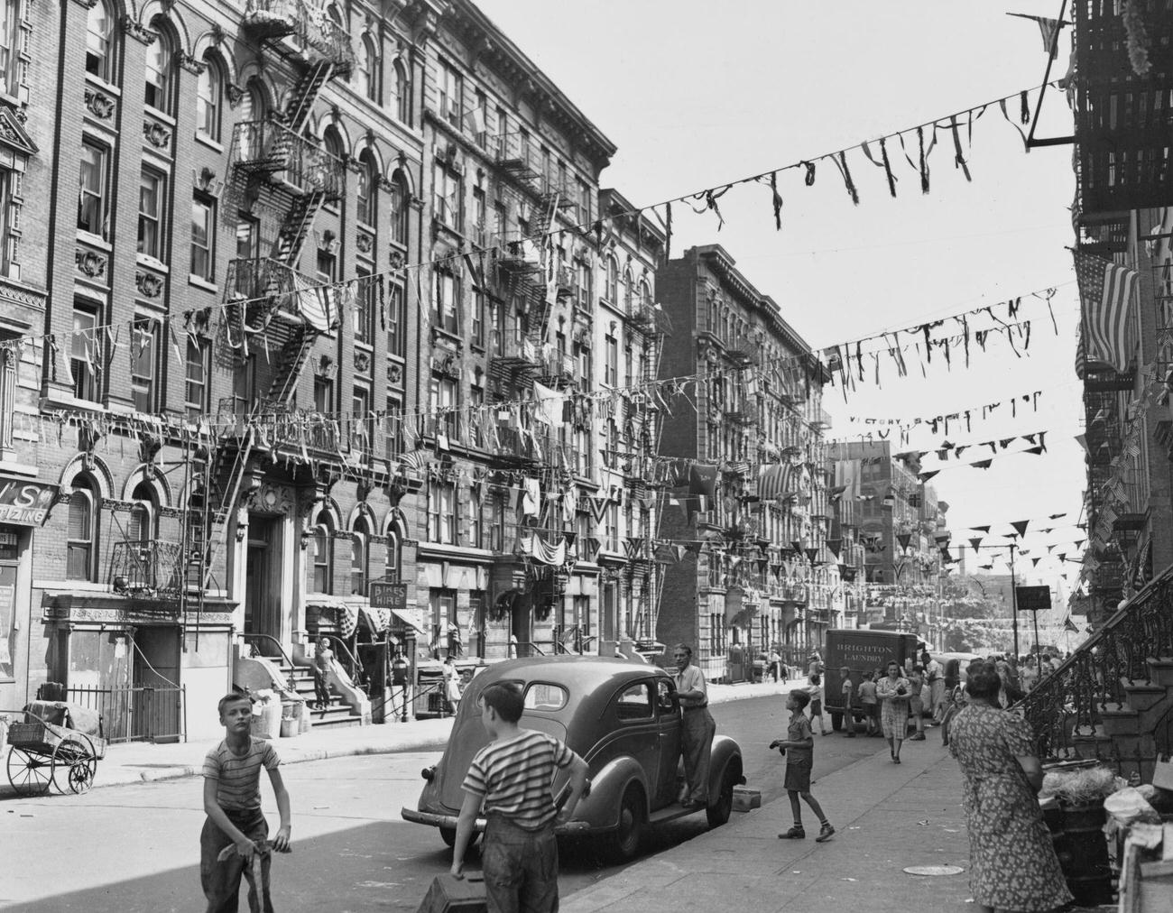 Flags And Streamers Decorate West Third Street, Brooklyn, 1945.