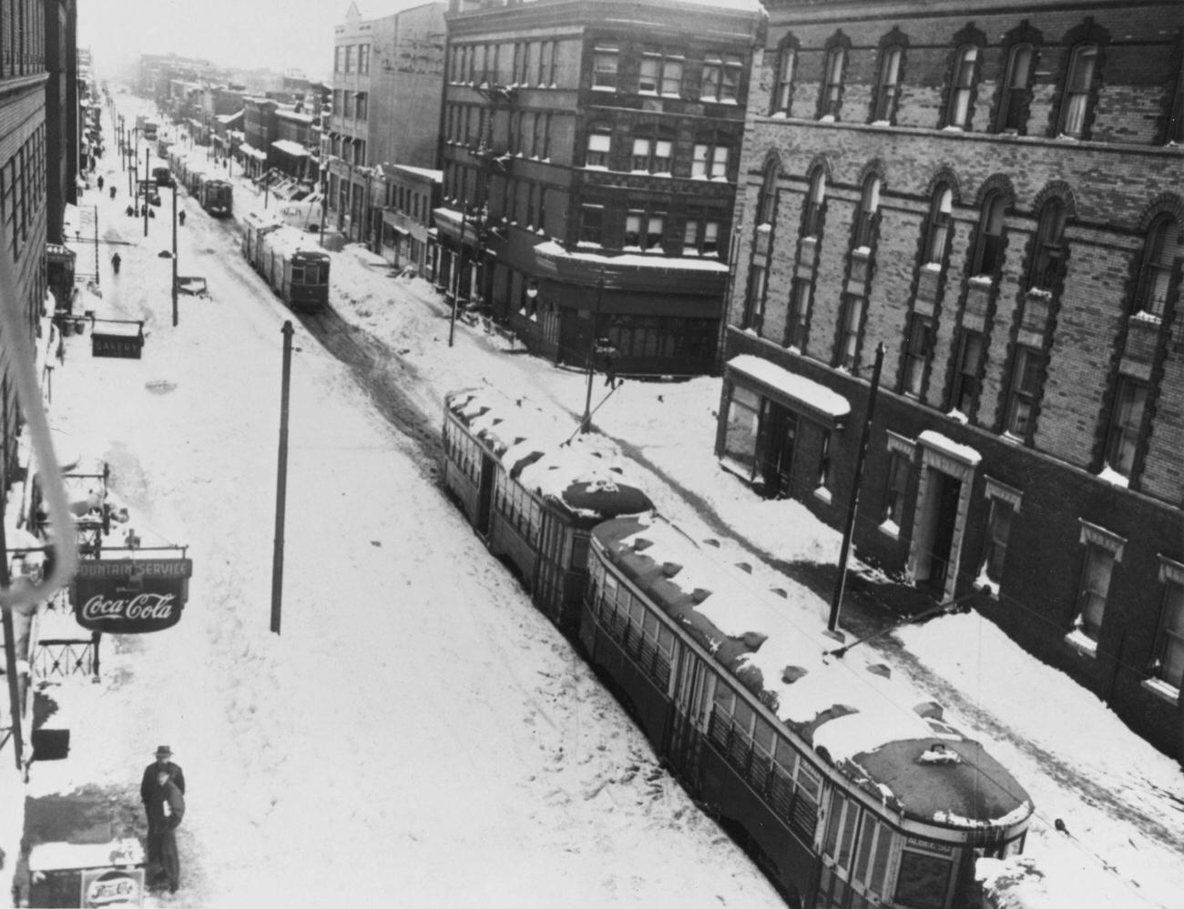 Snow-Covered Street With Passing Streetcars, Brooklyn, 1947