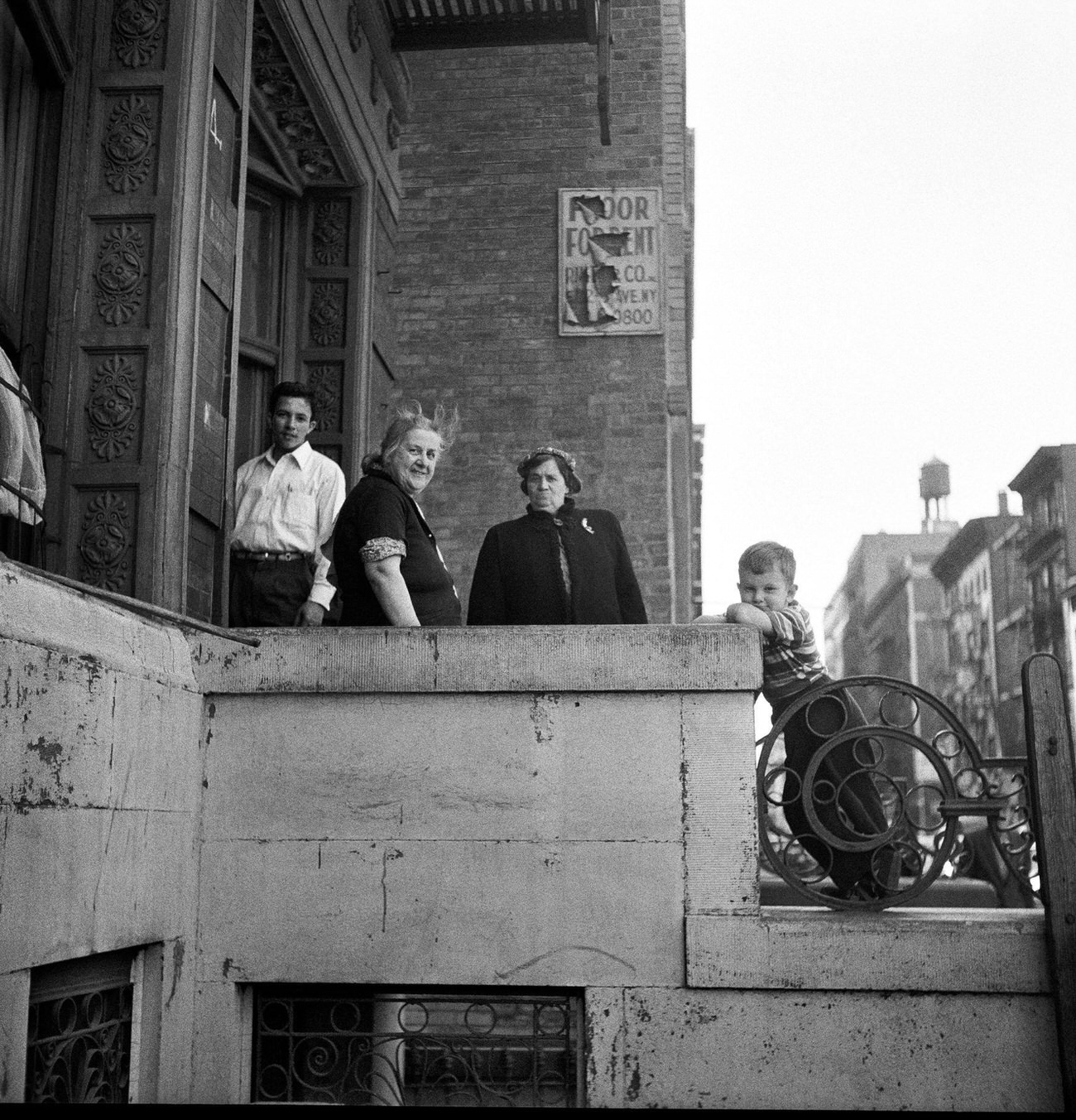 Adults And Boy On A Stoop Beneath A &Amp;Quot;Floor For Rent&Amp;Quot; Sign In Brooklyn Heights, 1958.