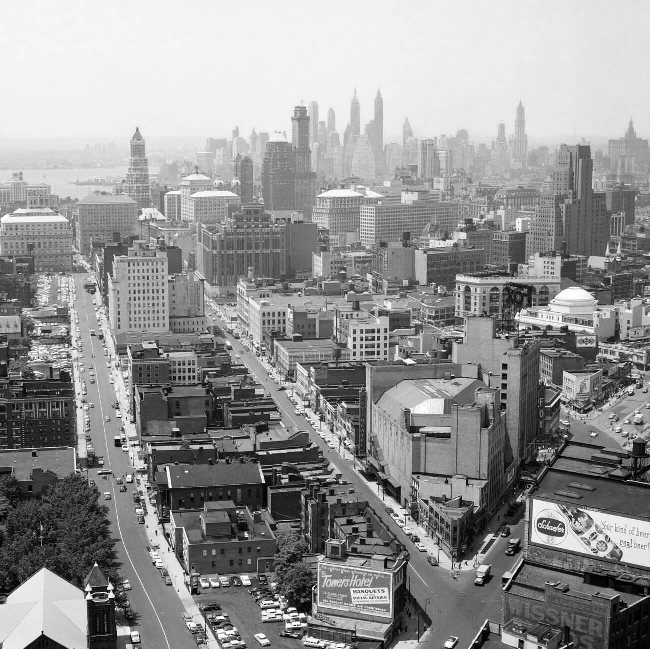 Aerial View Of Downtown Brooklyn With Manhattan Skyline On The Horizon, Taken From Williamsburg Savings Bank Tower, 1950S.