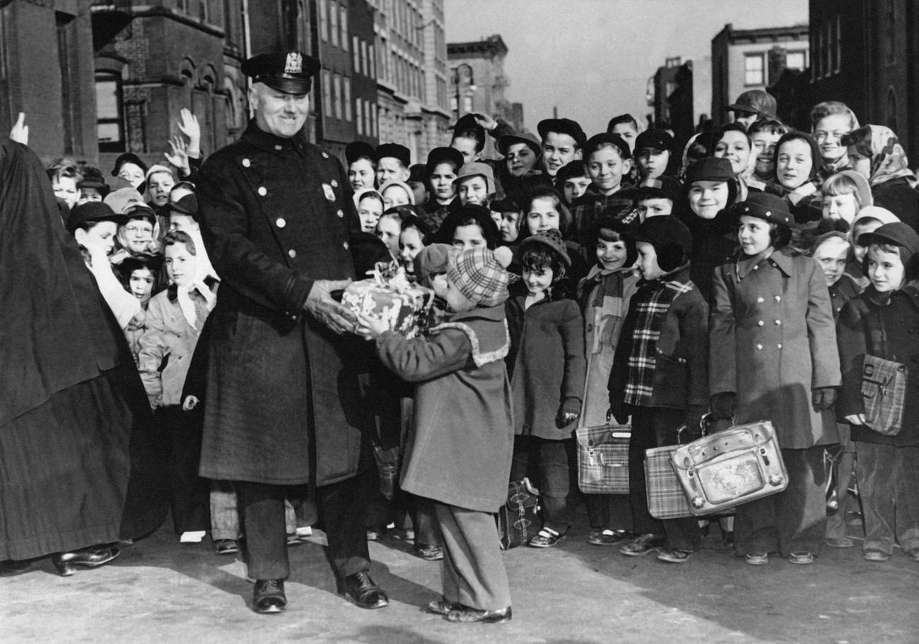 Children In Brooklyn Offer A Retirement Gift To Policeman Edward Bickel, 1950.