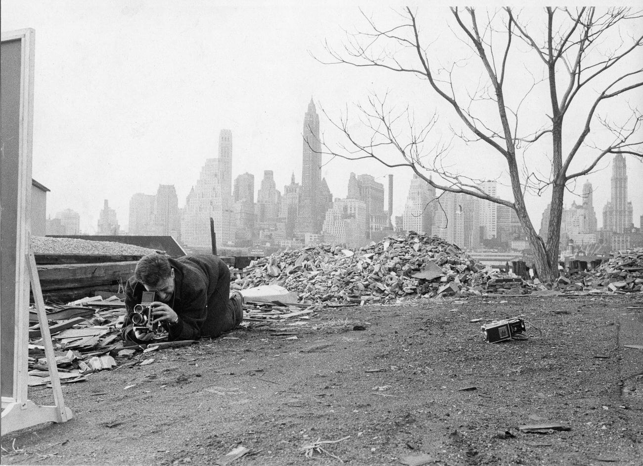 Photographer David Attie Capturing Manhattan Skyline In A Distorted Mirror, Brooklyn, 1958.