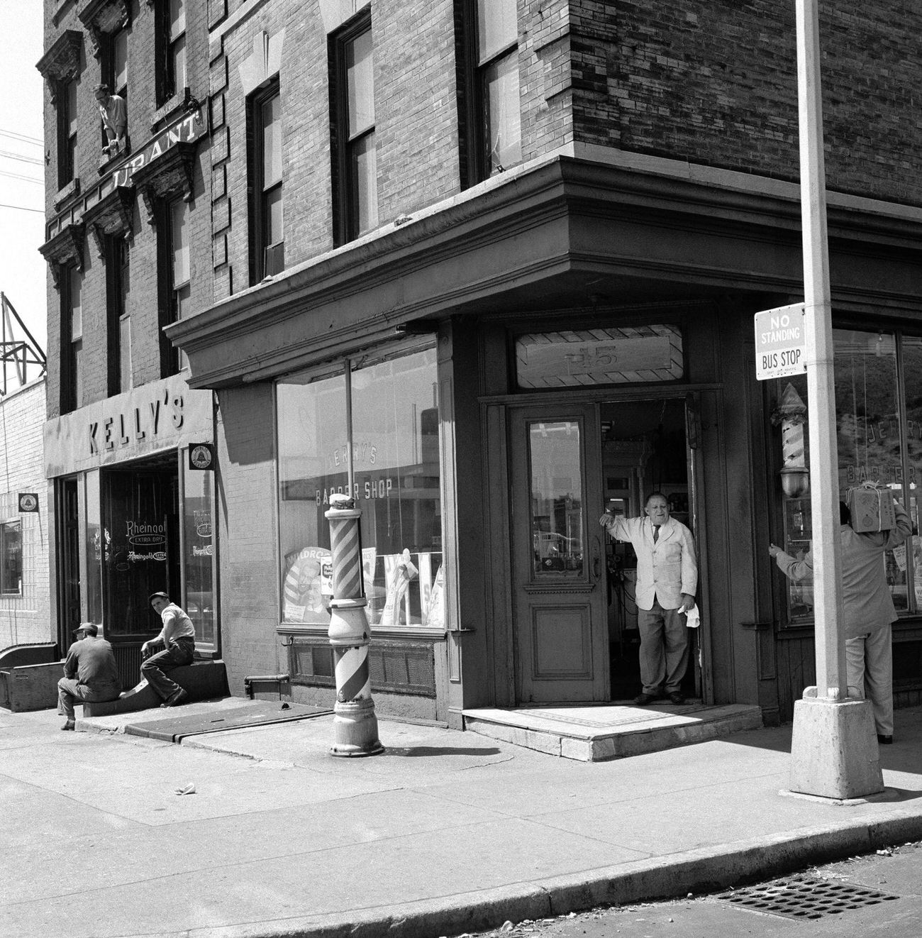 Barber Jerry Converses With A Delivery Man Outside His Shop At 15 Atlantic Avenue, Brooklyn Heights, 1958.