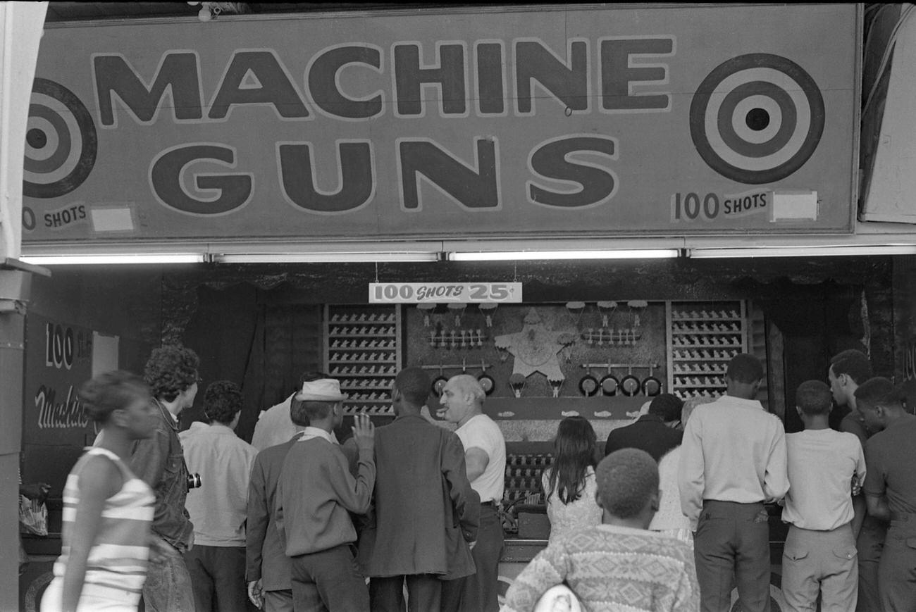 Contestants Gather Around The 'Machine Guns' Arcade At Coney Island, Brooklyn, 1968.