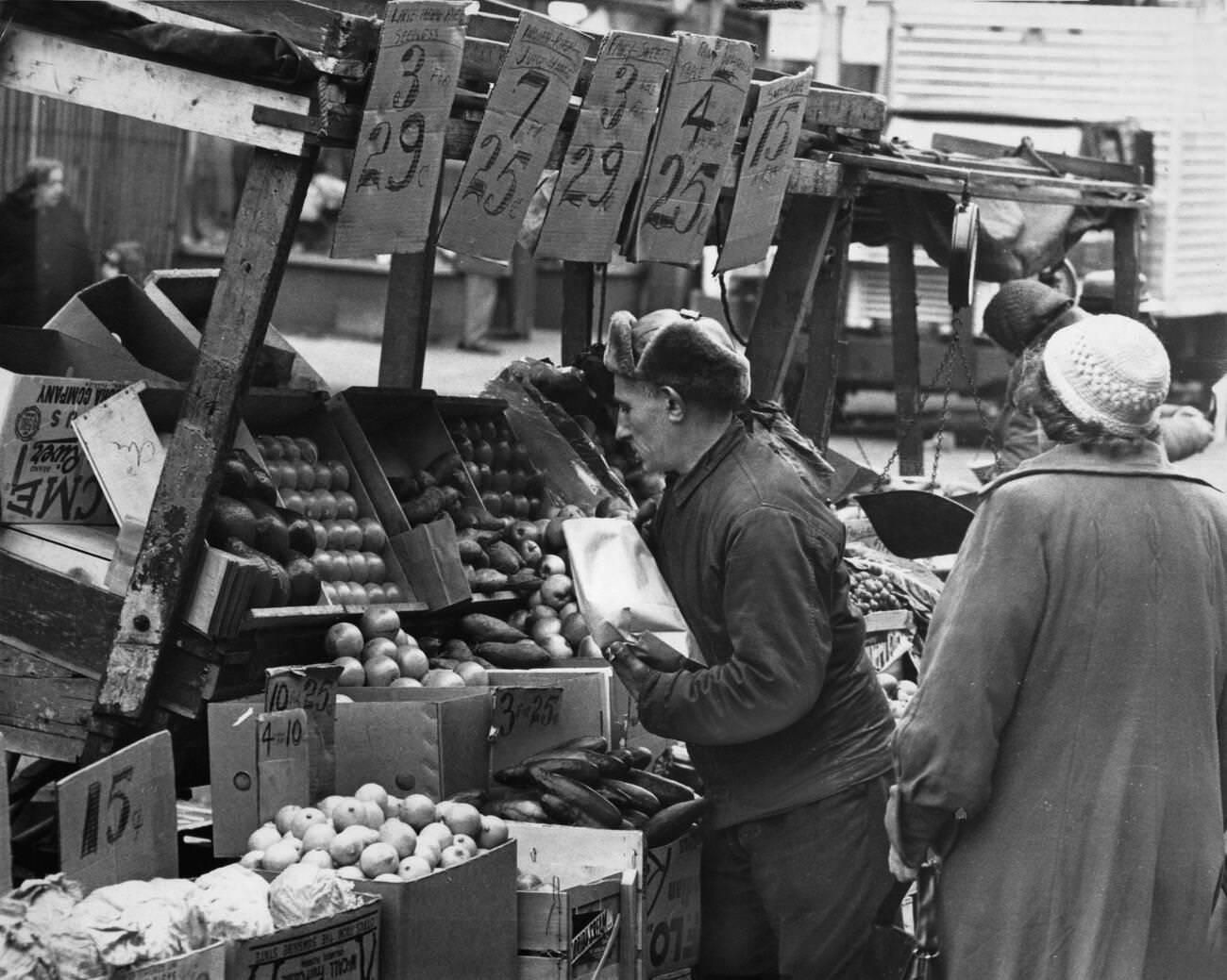 Vendor Sells Produce From His Pushcart At The Belmont Avenue Market, Brooklyn, 1962.