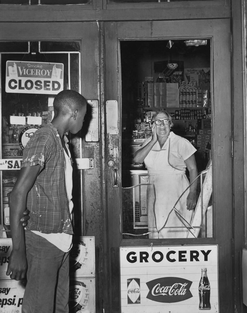 Anna Kelter Looks At Damage To Her Store After A Night Of Rioting In Brooklyn, July 21, 1964.