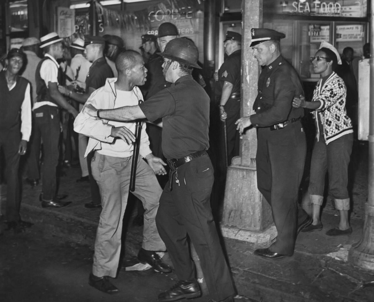 Policemen Confront A Group After A Night Of Rioting In Brooklyn, July 21, 1964.