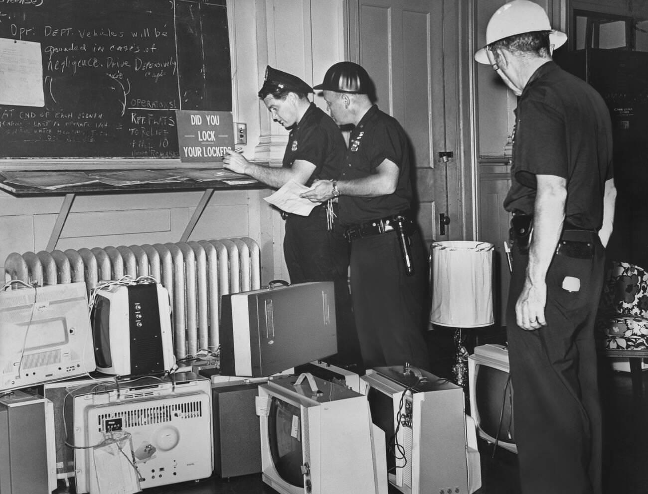 Officers Document Confiscated Items After A Night Of Rioting In Brooklyn, July 22, 1964.