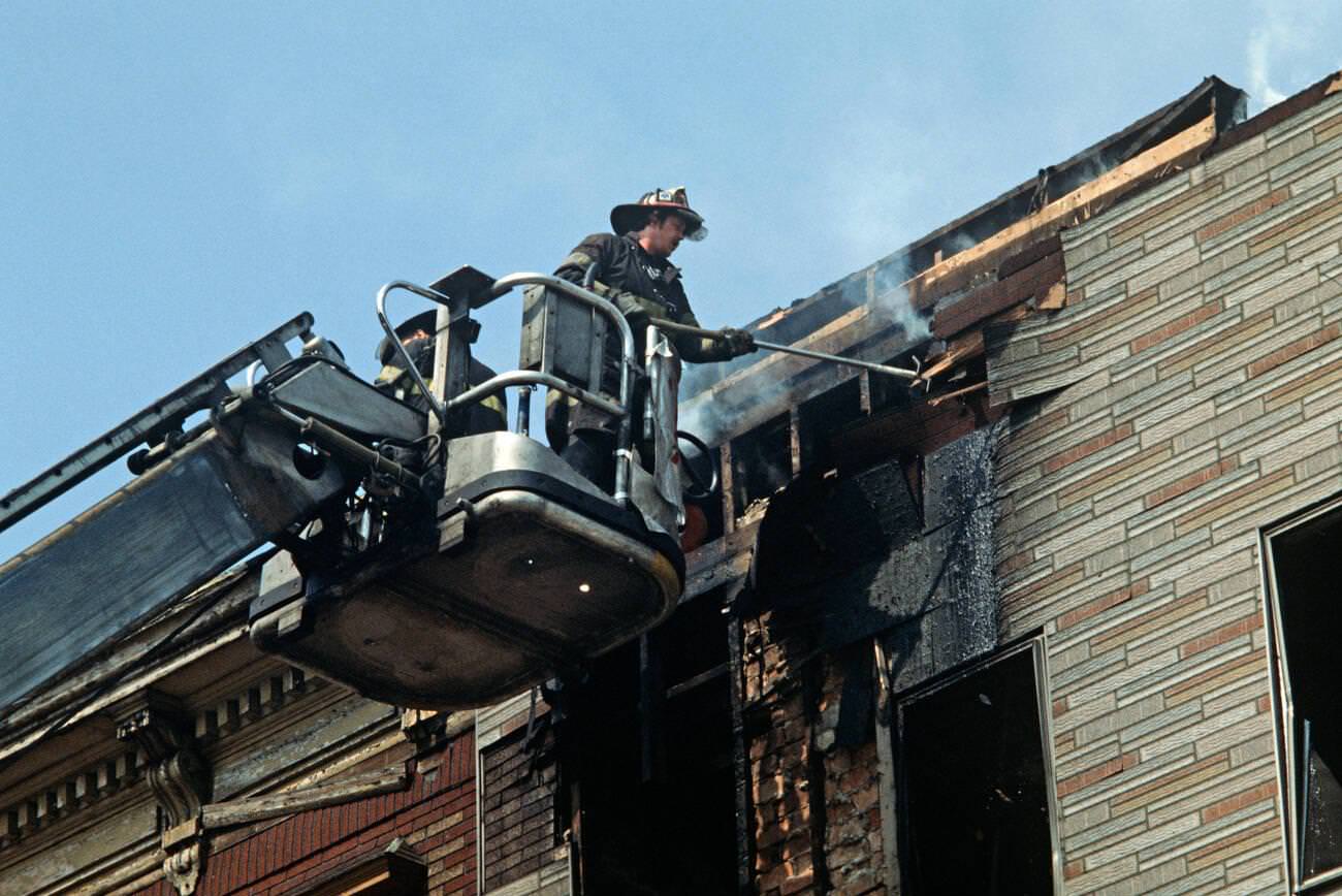 Fireman Attending A Fire In Abandoned Tenement Building In Brooklyn, 1977.