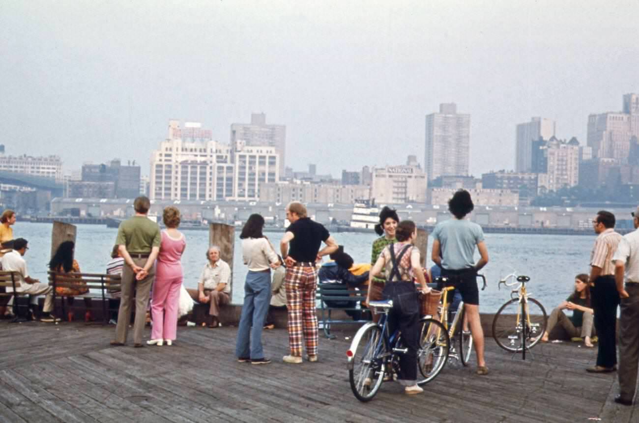 Visitors At South Street Seaport Pier, Opposite Shore Is Brooklyn, 1973.
