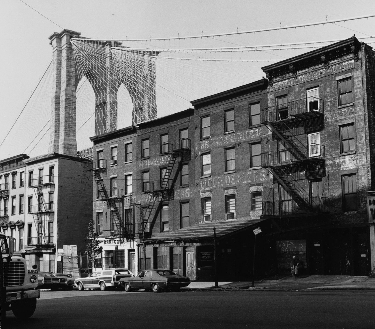 Buildings At Old Fulton Street With Brooklyn Bridge In Background, Brooklyn, 1975
