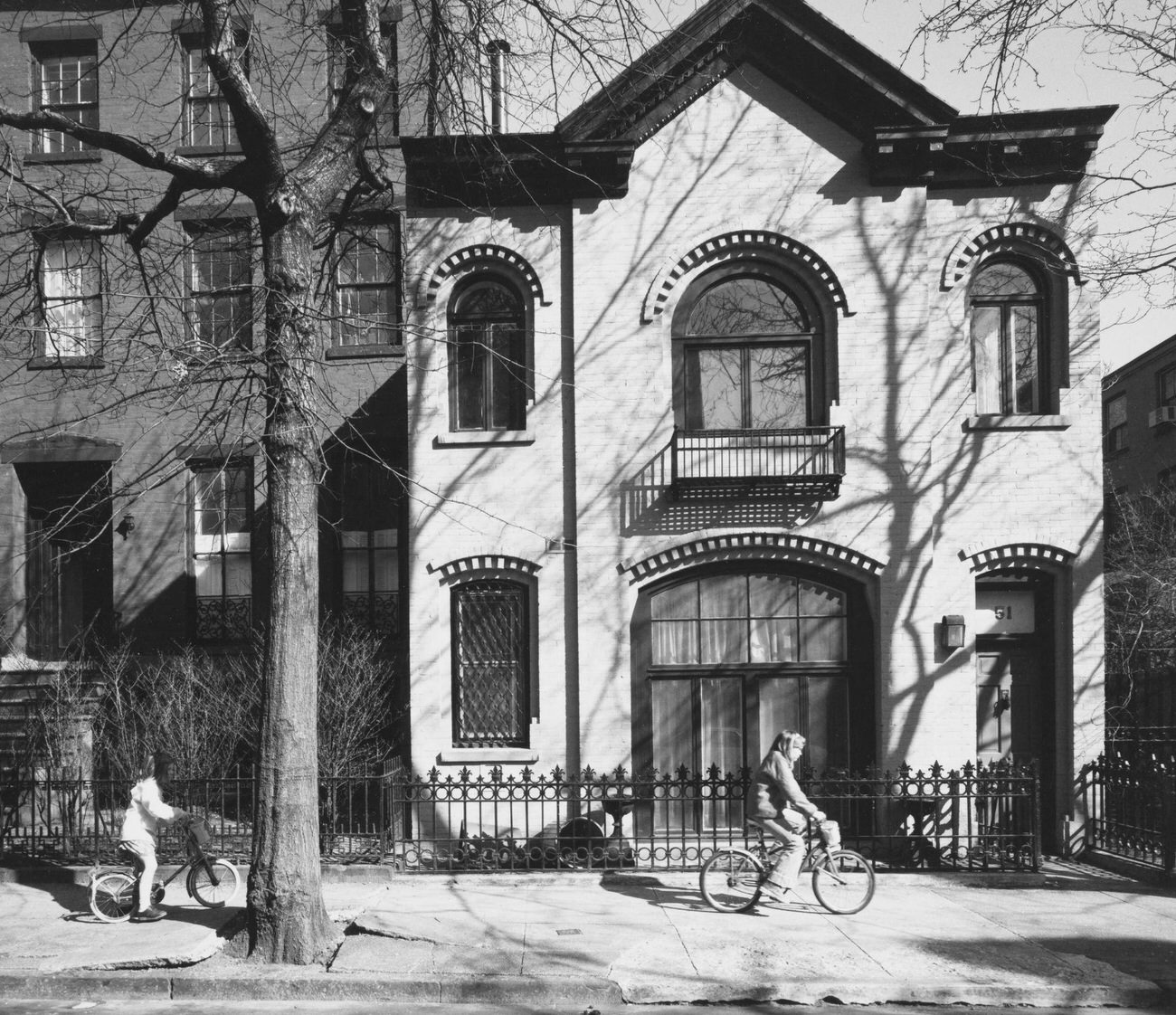 Children Bicycling Past 51 Sidney Place, Brooklyn, 1985.