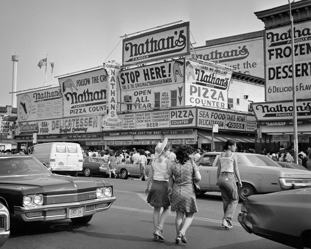 Pedestrians Head To Nathan'S Hot Dog Stand At Coney Island Beach, Brooklyn, 1970S