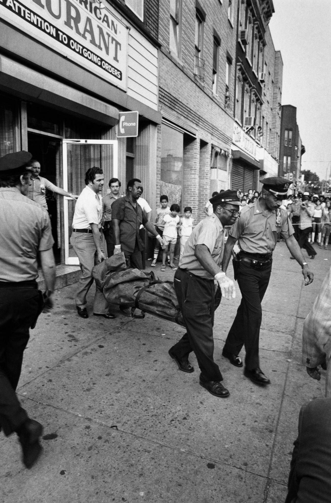 The Body Of Nino Cappolla Carried From Joe And Mary'S Restaurant After Being Shot Dead, Brooklyn, 1979