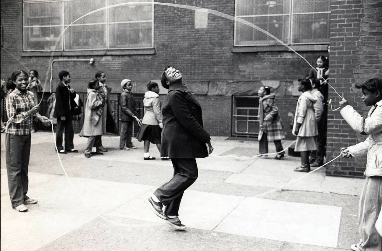 Young Girl Does Double Dutch Jump Rope In A Brooklyn Schoolyard, 1981.