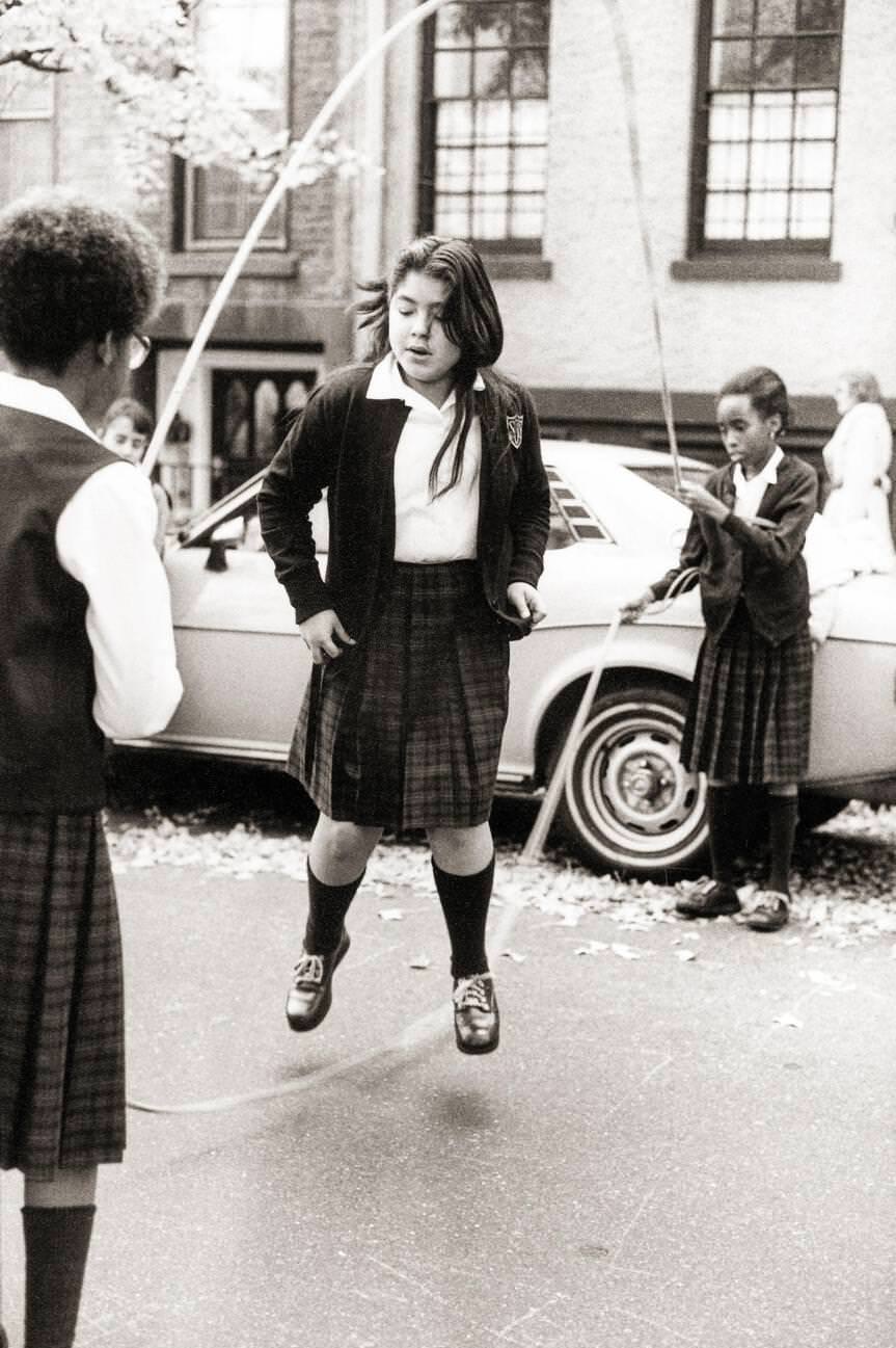 Schoolgirls Play Double Dutch On A Brooklyn Side Street, Early 1980S.