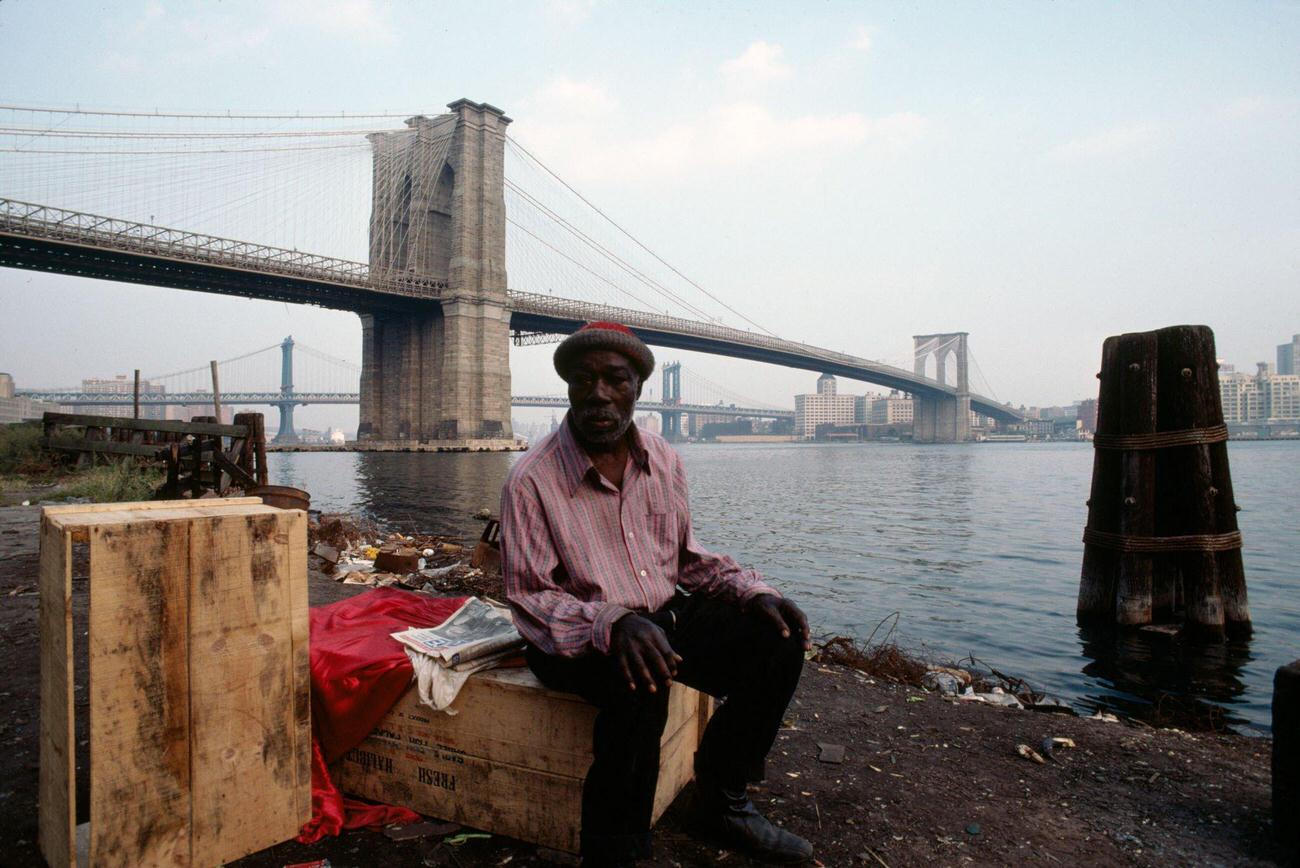 Man Sits By East River Near Brooklyn Bridge, 1980