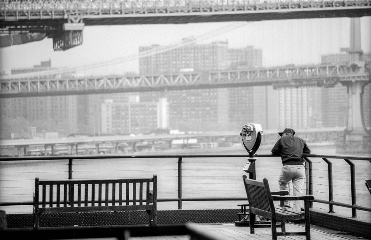 Person Views Brooklyn And Manhattan Bridges From South Street Seaport, 1990S