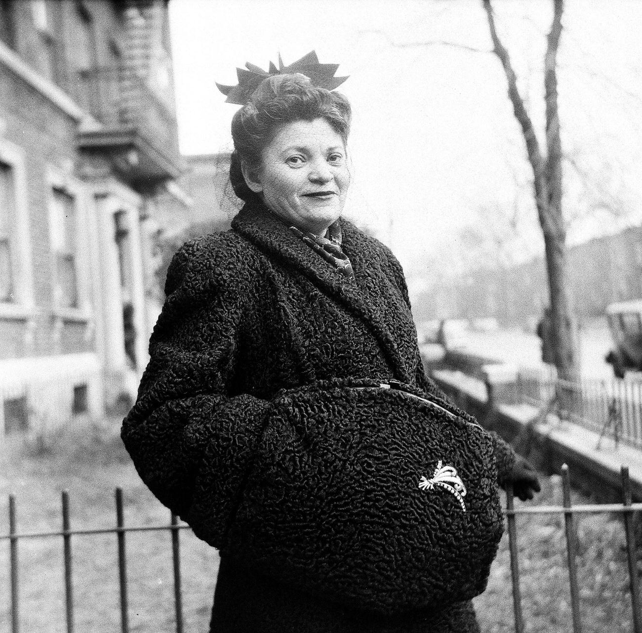 Portrait Of Ida Alman Posing Beside A Metal Fence, 1944