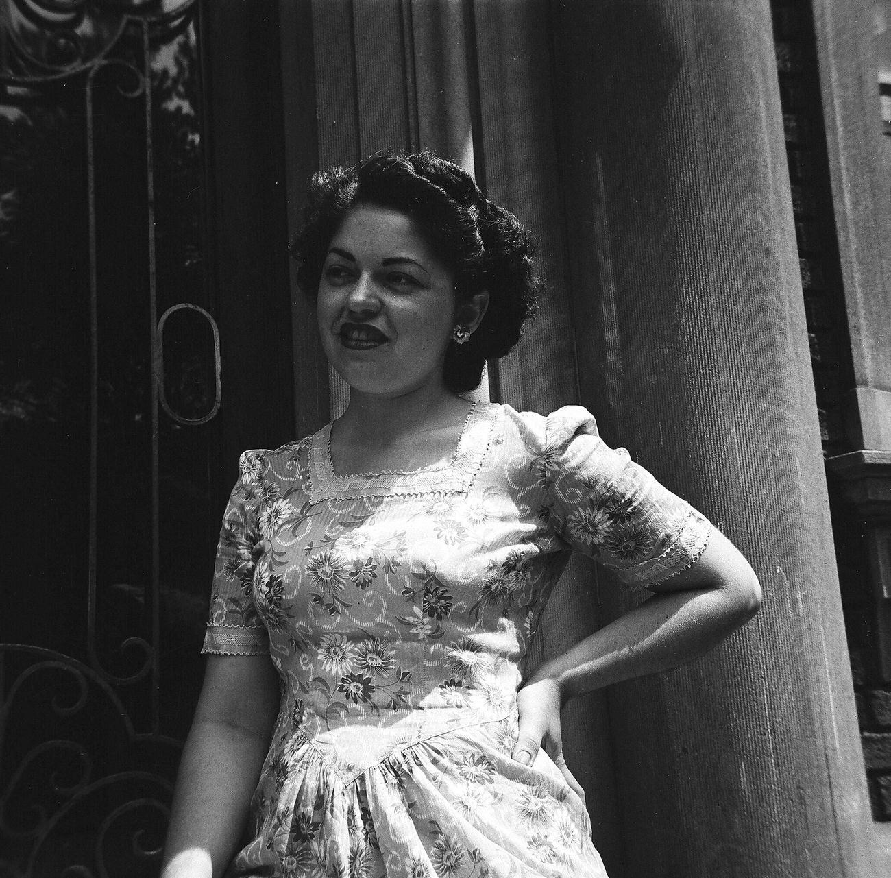 Rae Russel In Floral Dress Leaning In A Doorway, 1944