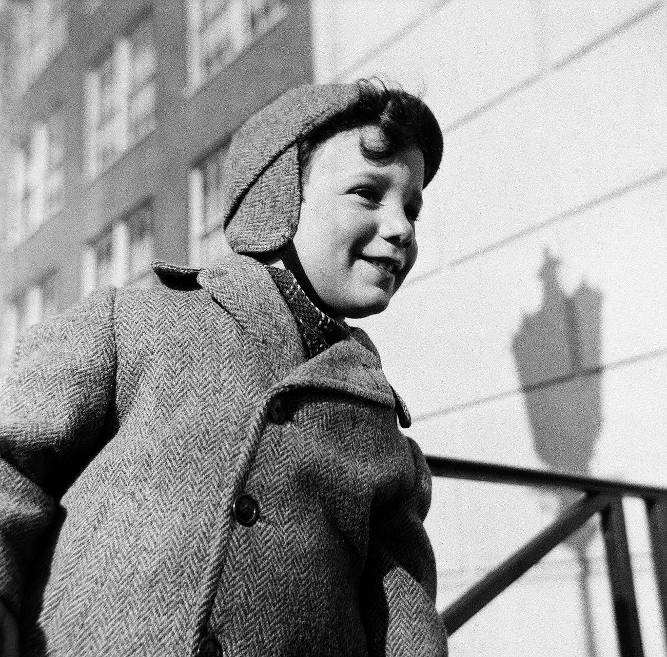 Young Boy Playing On A Stoop In Winter Clothing, 1944