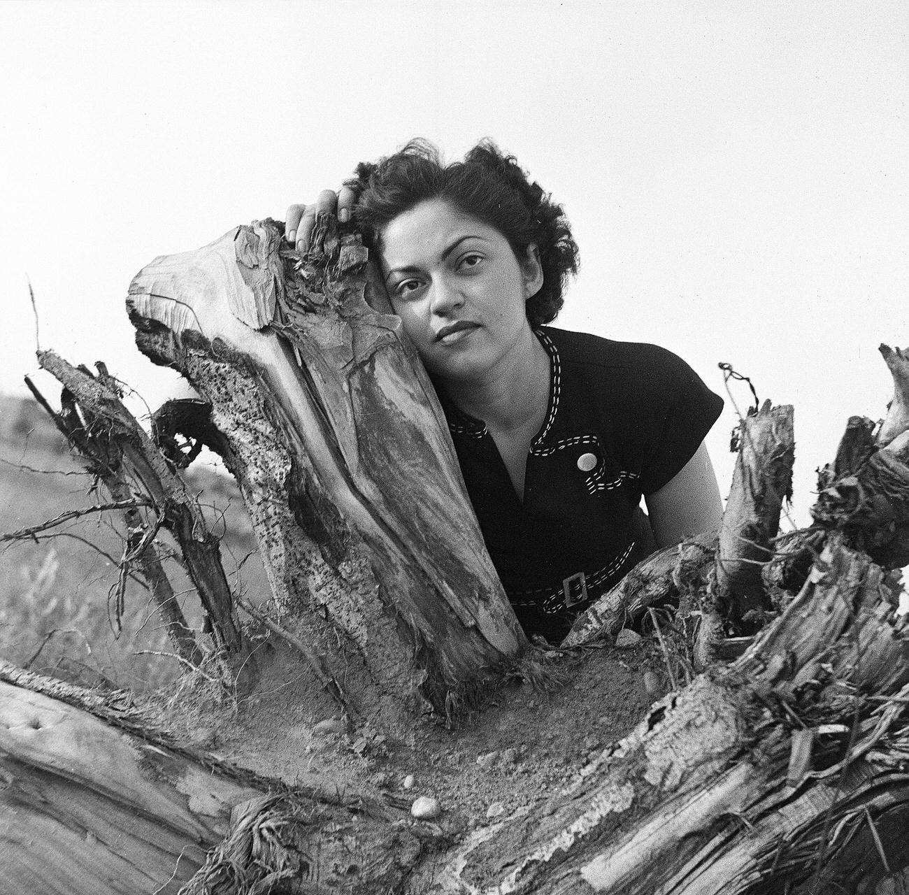 Rae Russel Beside An Uprooted Tree, 1945