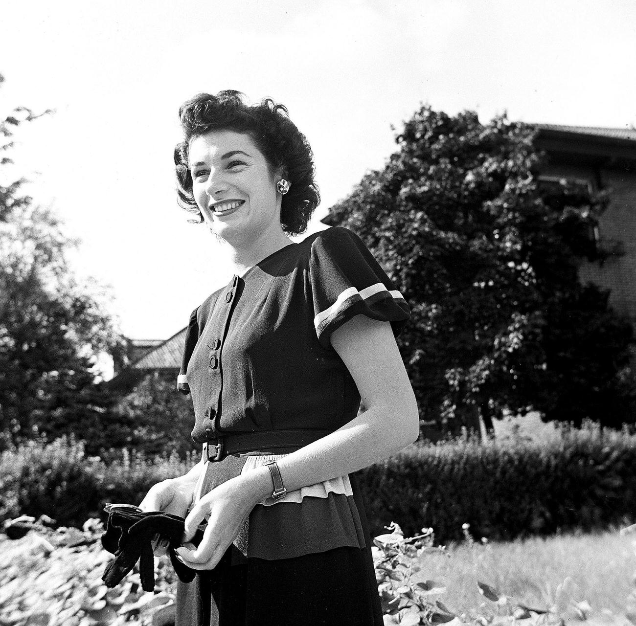 Woman With Gloves Posing Outdoors, 1945