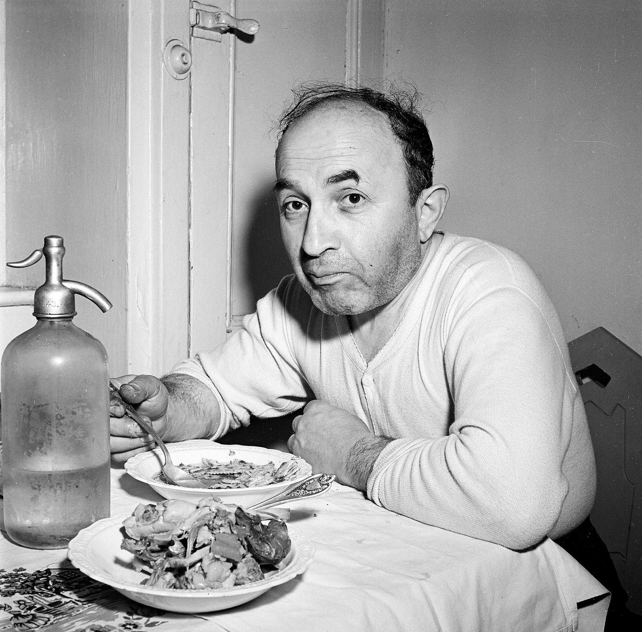 Man Eating A Meal At A Kitchen Table, 1945