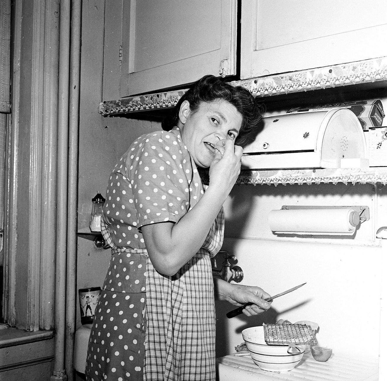 Woman Tasting Food While Cooking In The Kitchen, 1945