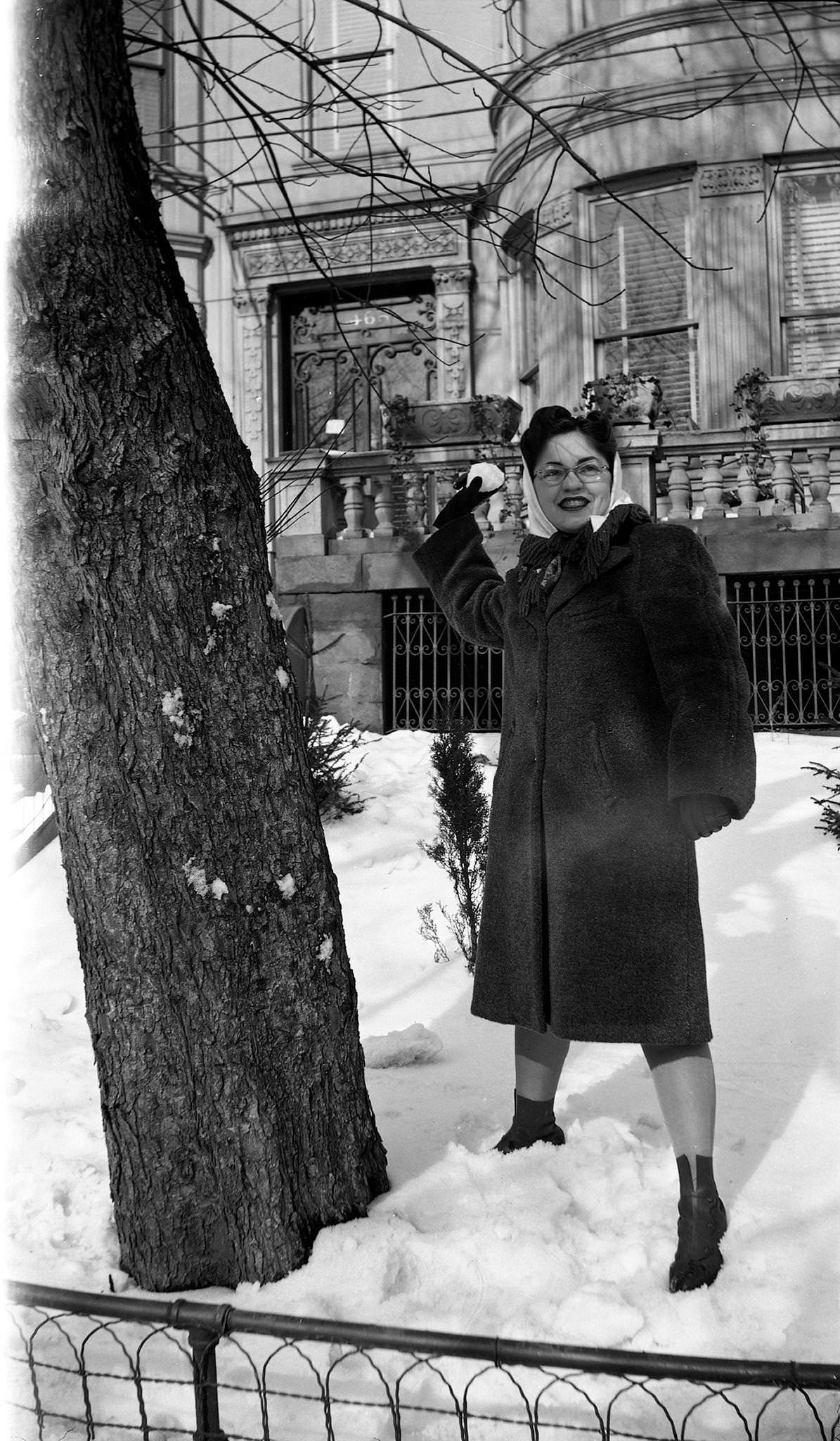 Rae Russel Preparing To Throw A Snowball, 1944