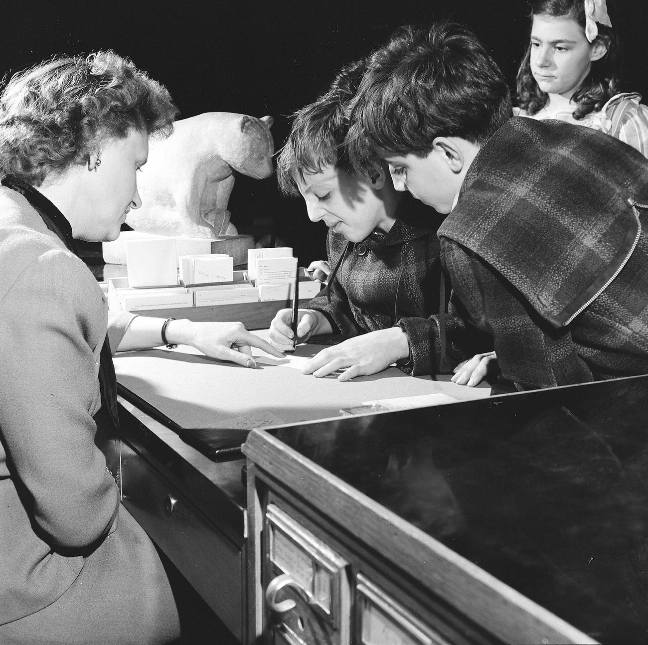 Librarian Advising Children On Book Choices, 1947