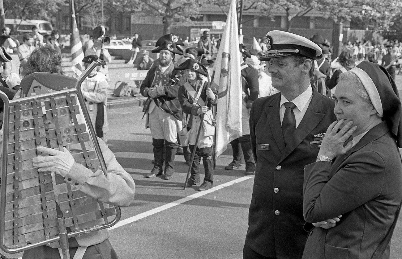 Us Armed Forces Member And Nun Watch Brooklyn Bridge Centennial, 1983