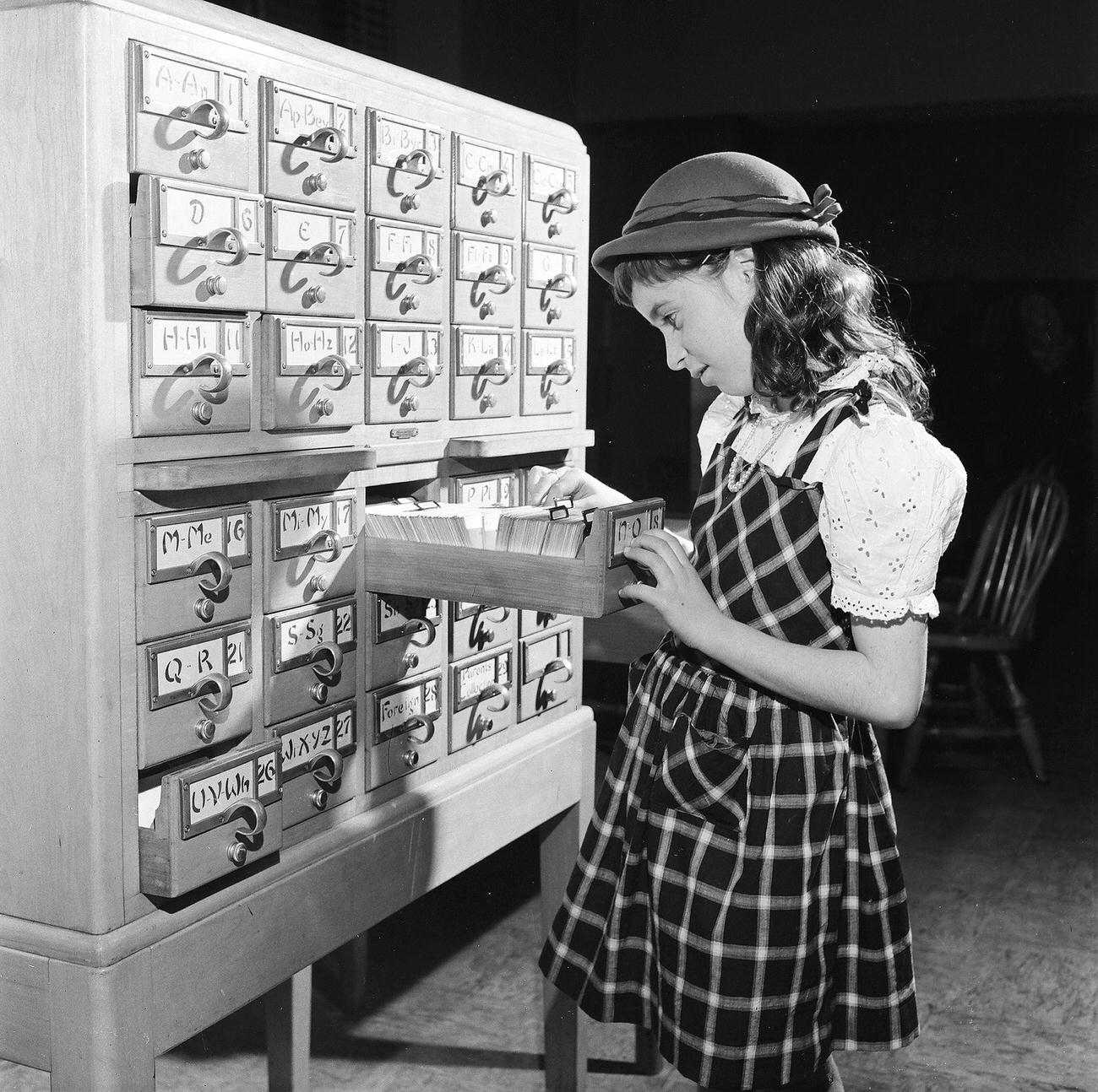 Girl Searches For Books Via Catalogue, 1947