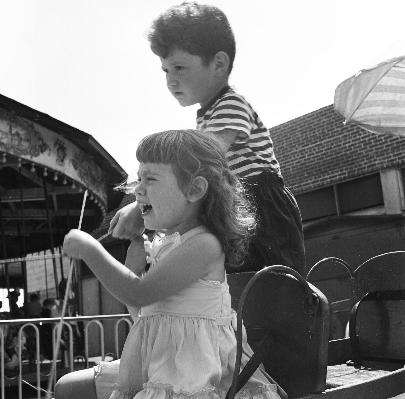 Siblings On Amusement Park Ride, 1948