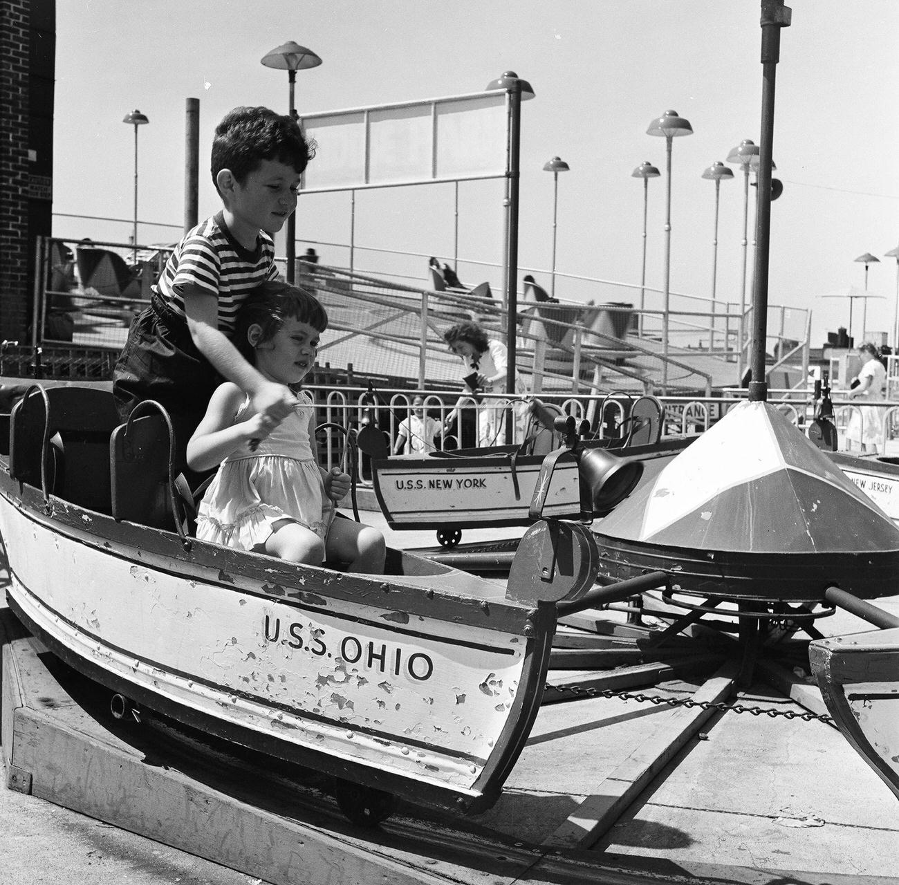 Siblings Enjoy Wooden Uss Ohio Ride At Coney Island, 1948