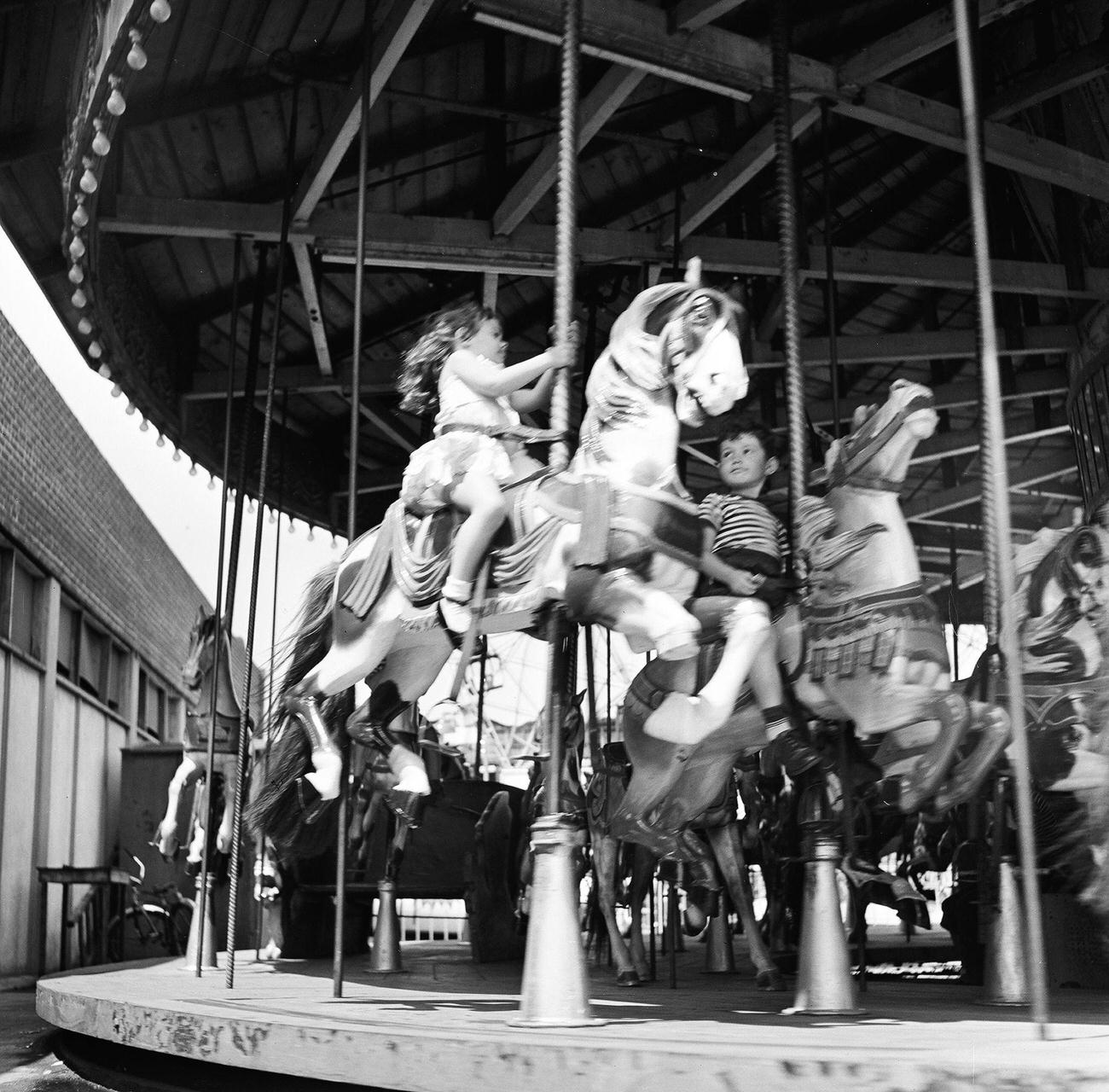 Siblings Enjoy A Carousel Ride At Coney Island, 1948