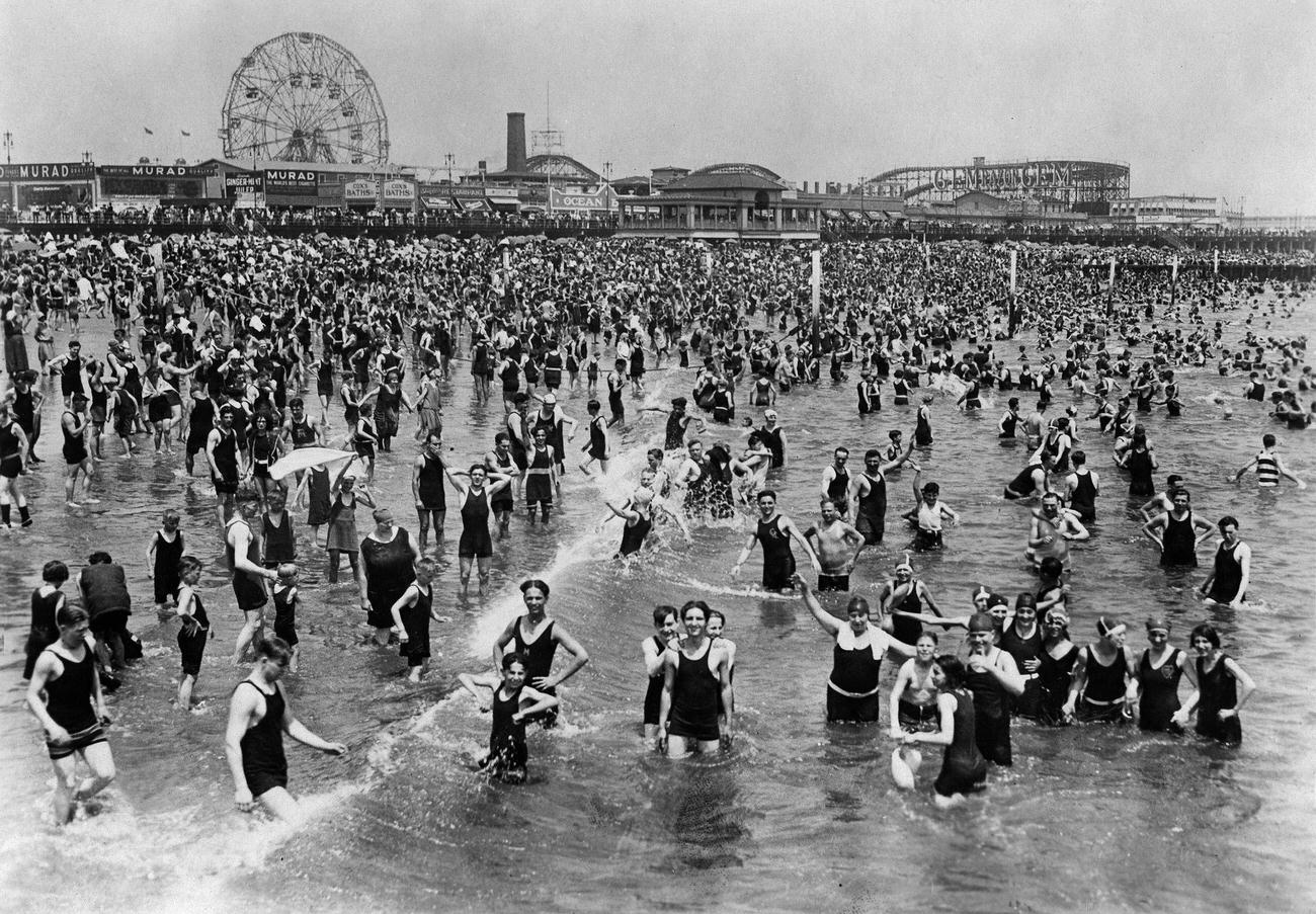 Crowded Beach With Amusement Park In Background, 1928