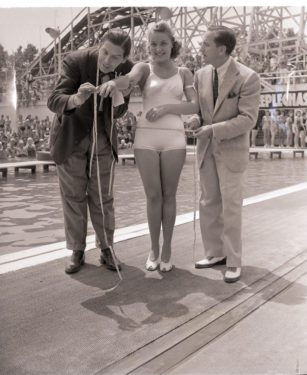 Milton Berle Measures Beauty Contest Winner Grayce Reilly, Coney Island, August 1, 1939