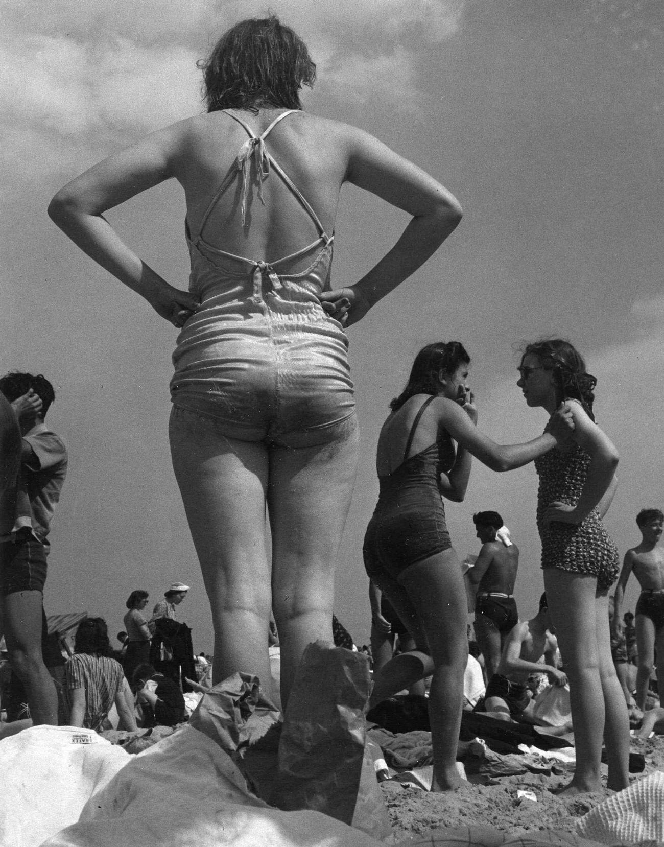 Woman Surveys Coney Island Beach, 1938
