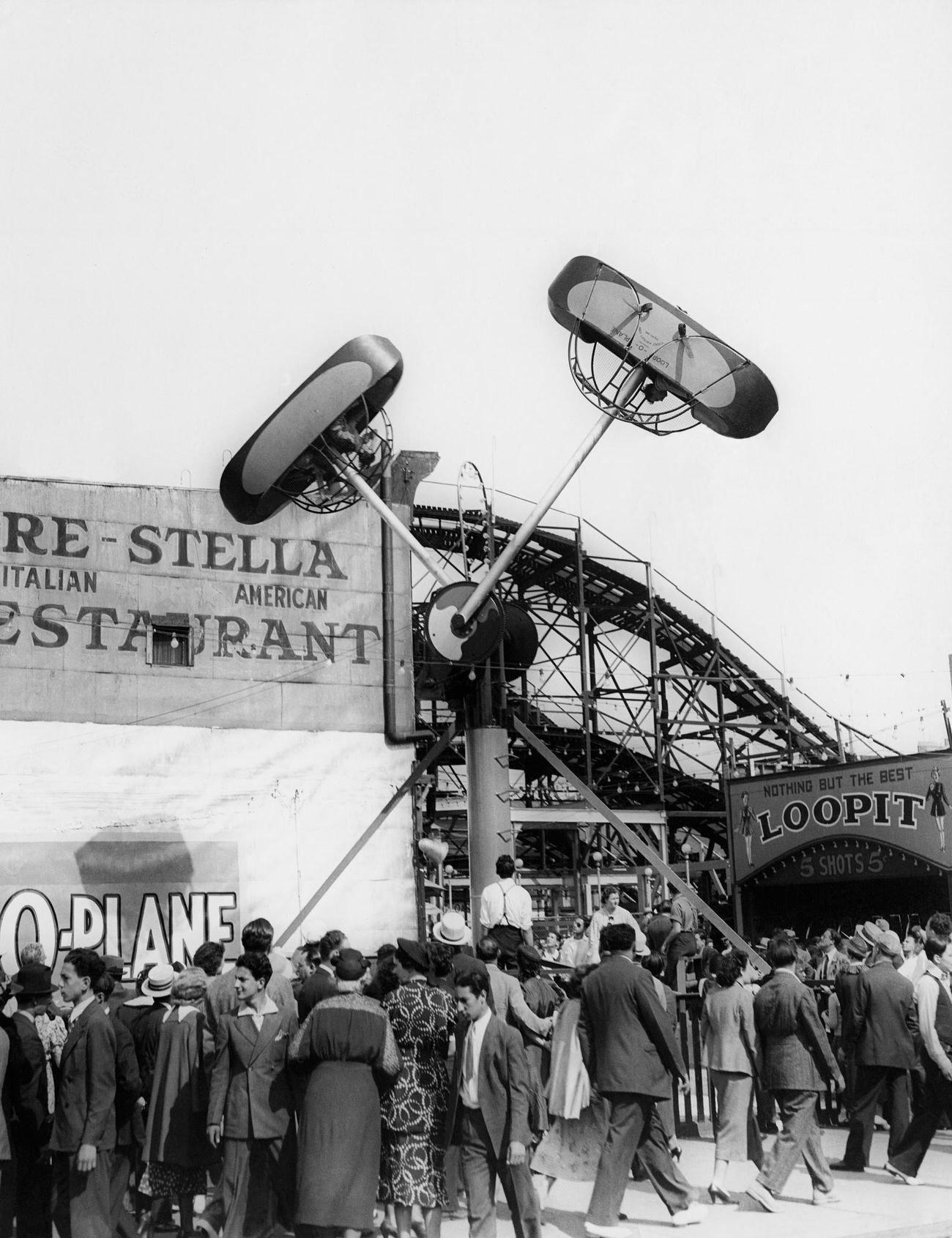 Crowd Attracted By Loop-O-Plane Ride At Coney Island