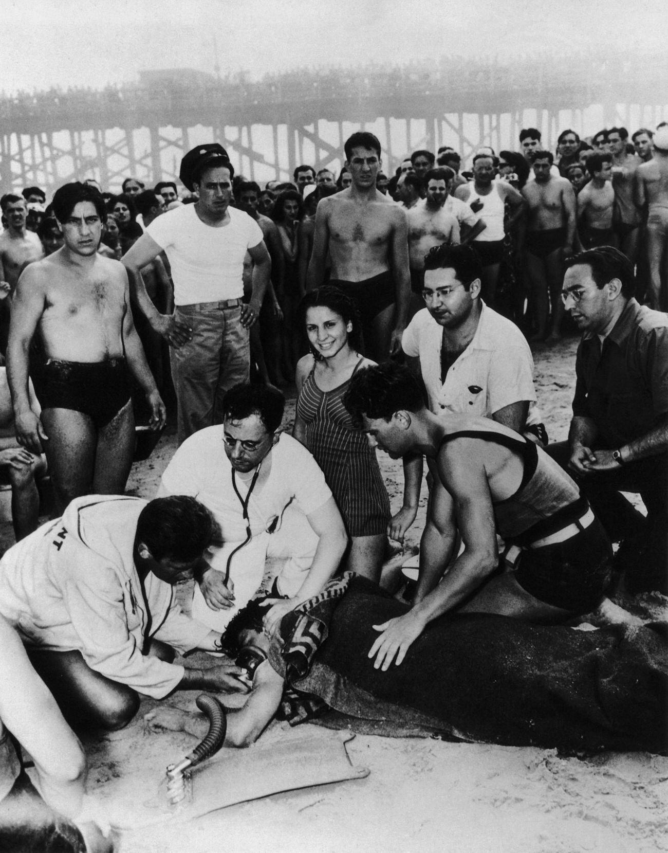 Lifeguard And Doctor Attempt To Save Swimmer, 1940