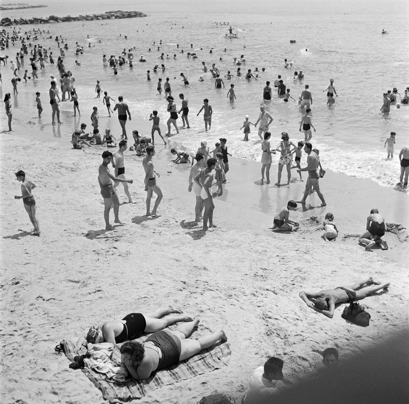 People Enjoying Sun And Sea At Coney Island Beach, 1946