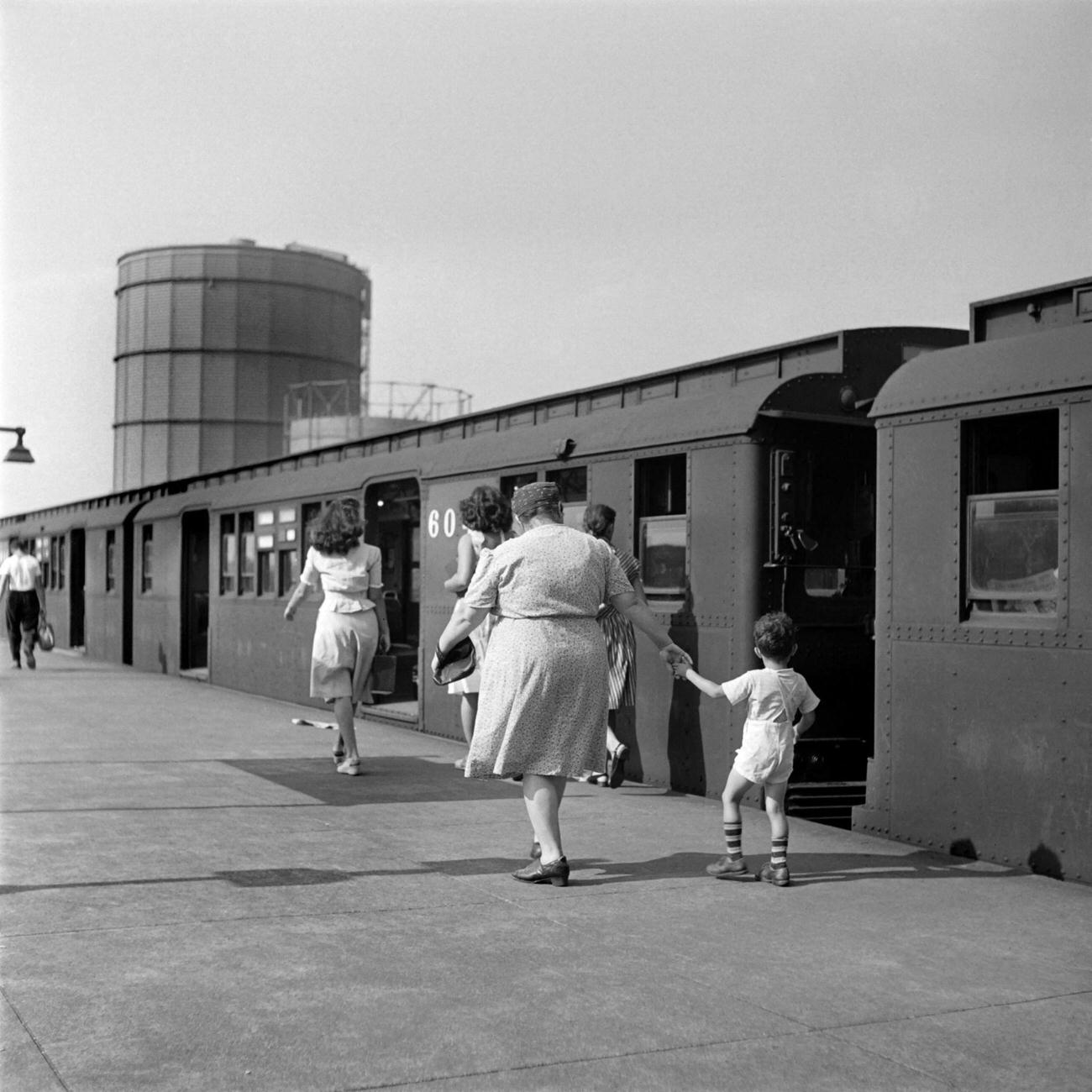 Woman And Child Leaving Coney Island By Metro, 1946