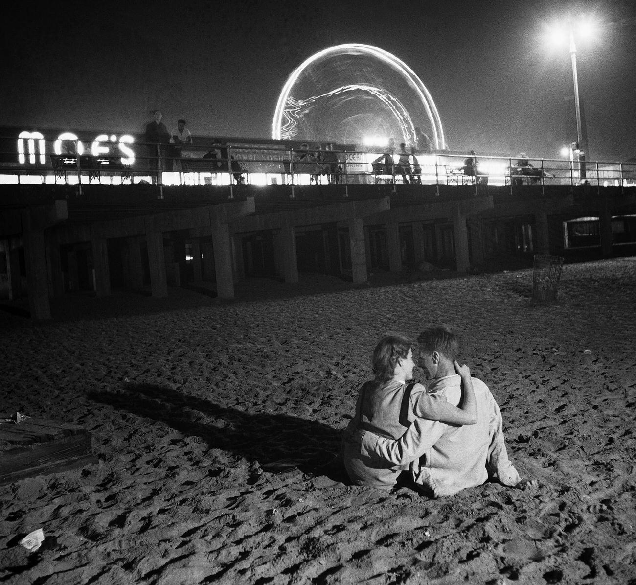 Young Couple Embracing On Coney Island Beach