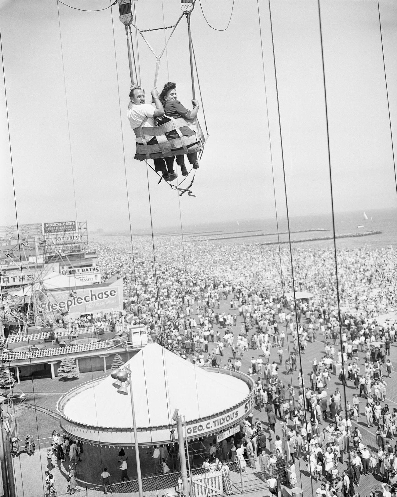 Couple Takes A Ride On Coney Island'S Parachute