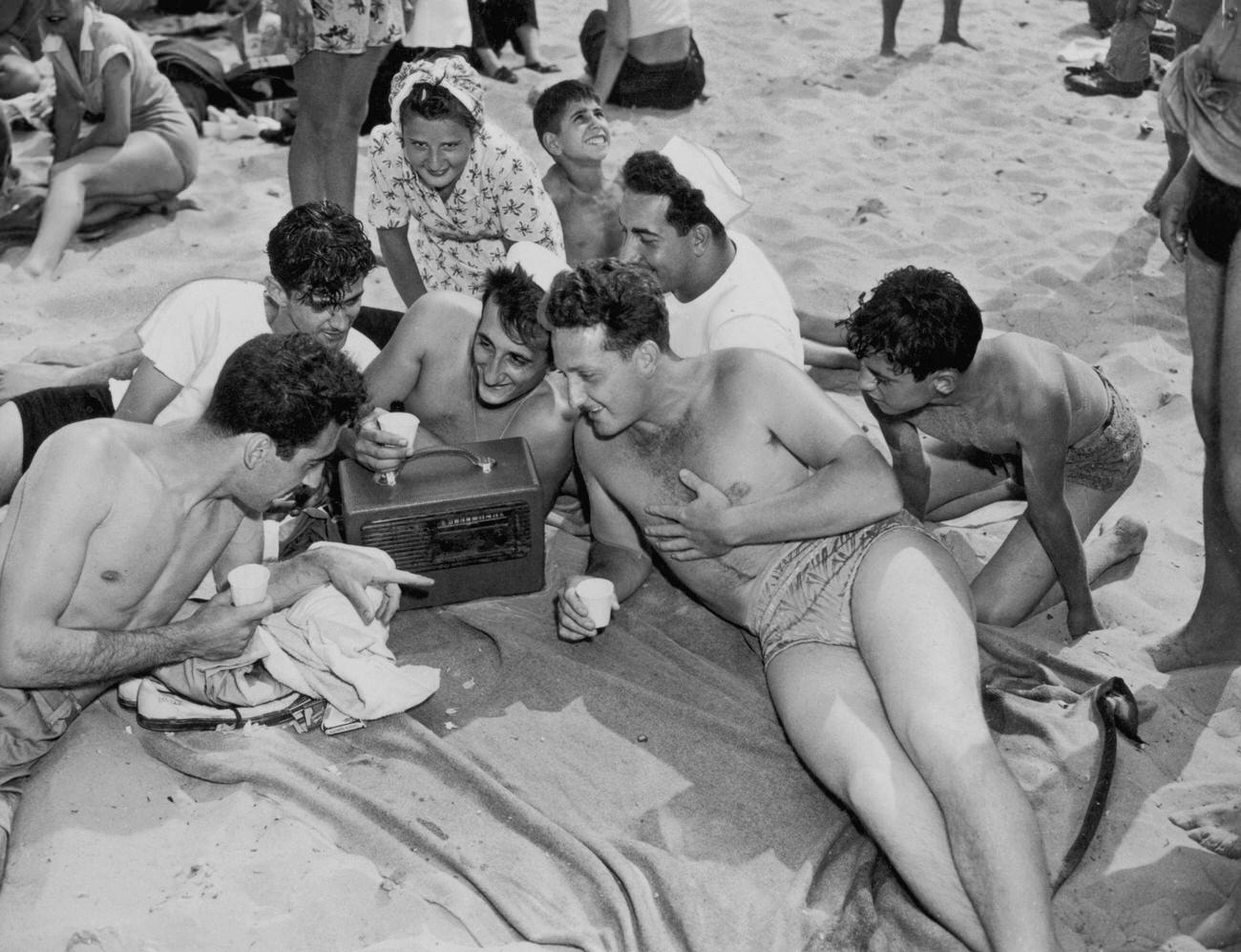 Young People Listen To Portable Radio On Coney Island Beach, 1947