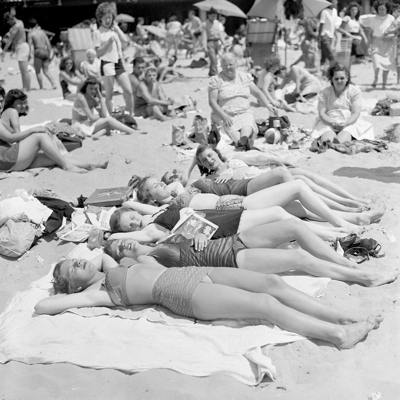 Curve-Tossing Women Enjoy Coney Island Beach, July 4