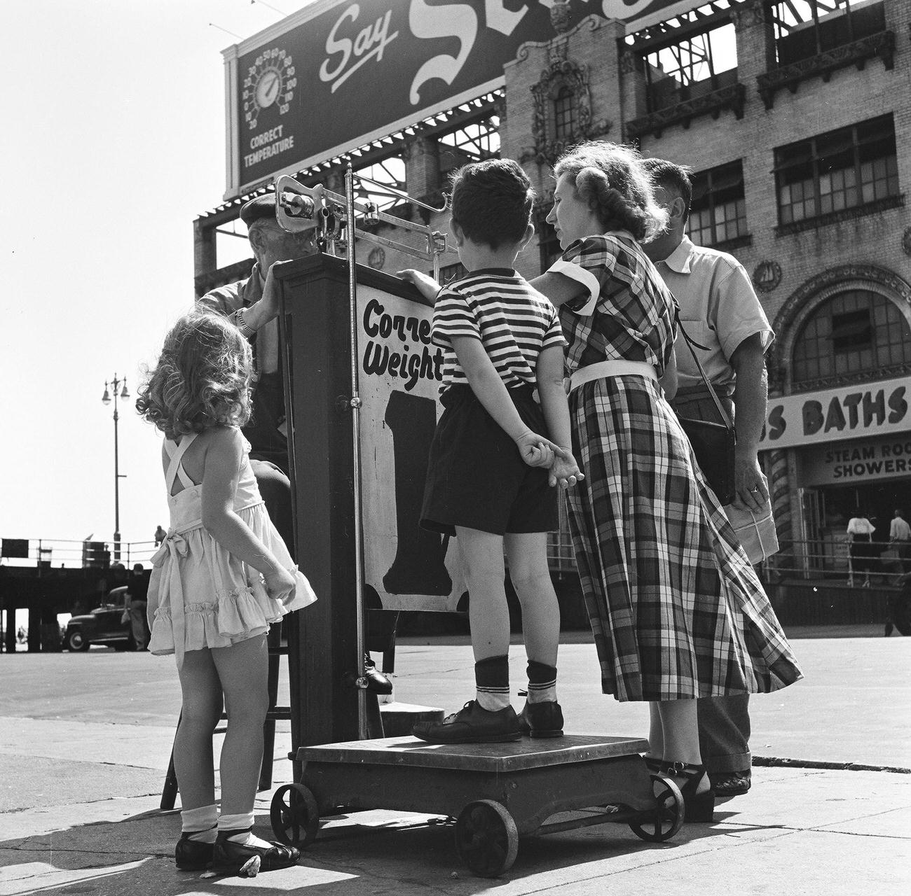 Boy Measures Weight On Scale At Coney Island, 1948